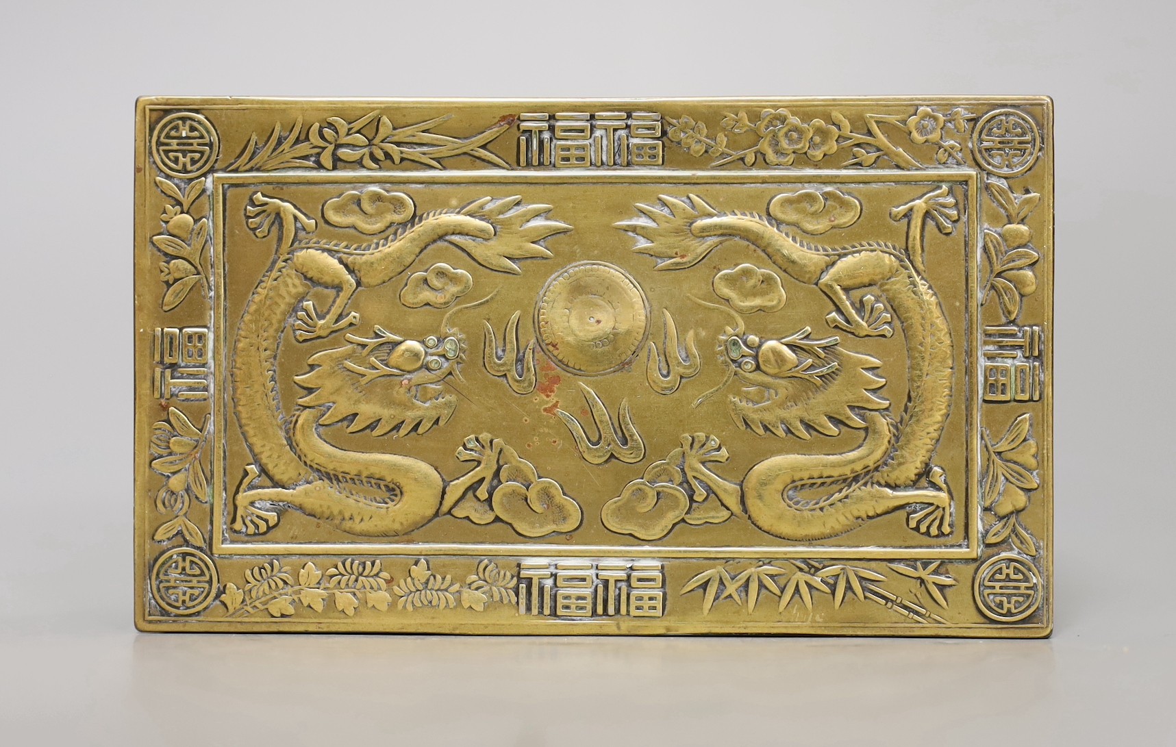A 1920s Chinese brass 'dragon' cigarette box, 15.5cm
